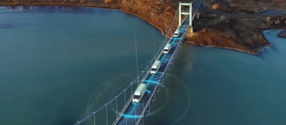 delivery vans driving across bridge with digital overlay