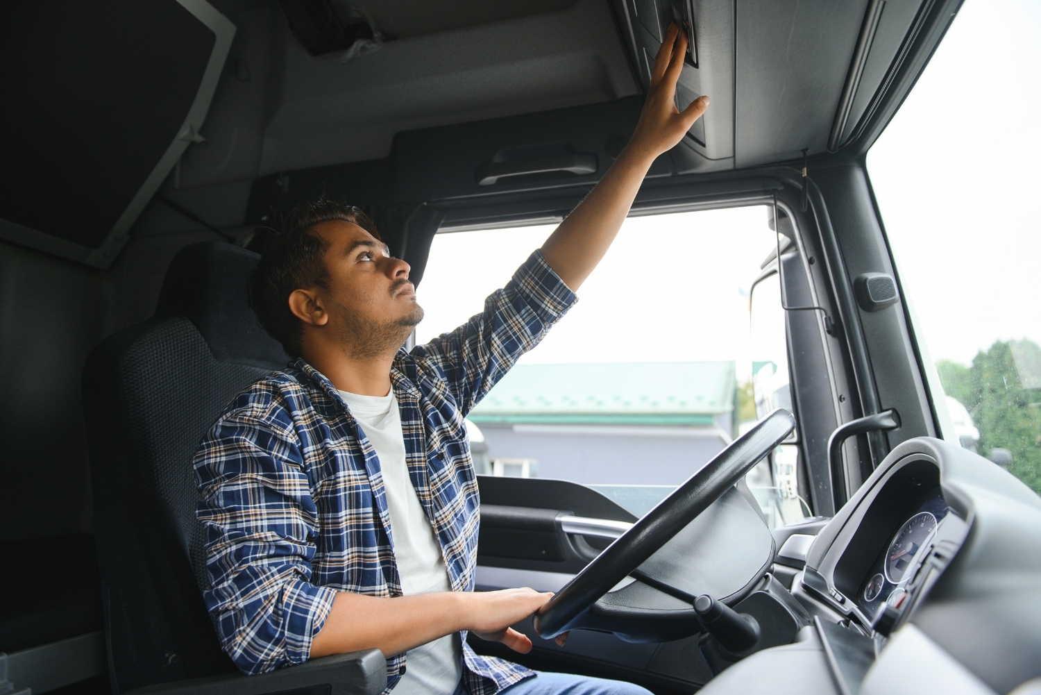 hgv driver checking tachograph