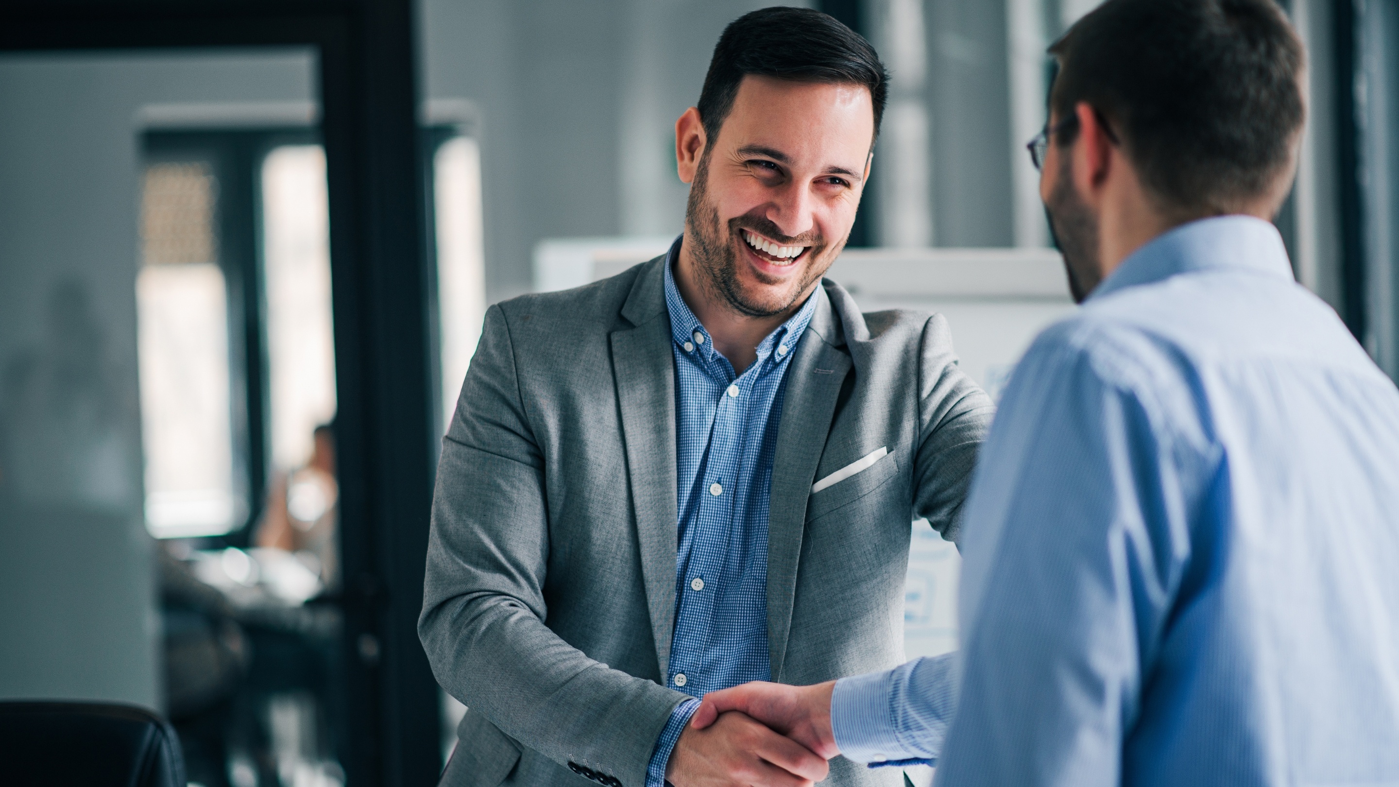 Fleet manager and expert shaking hands